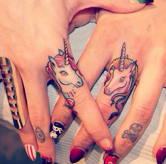 unicorn finger tattoo