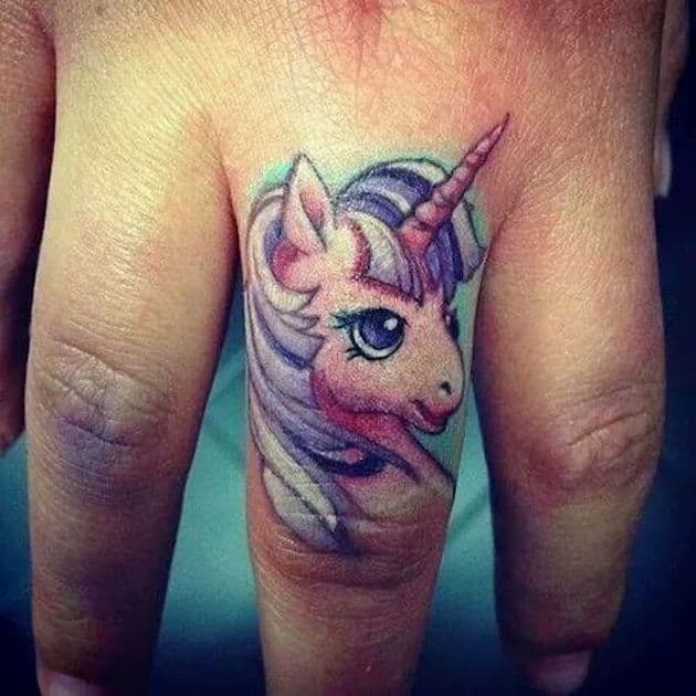 unicorn finger tattoo