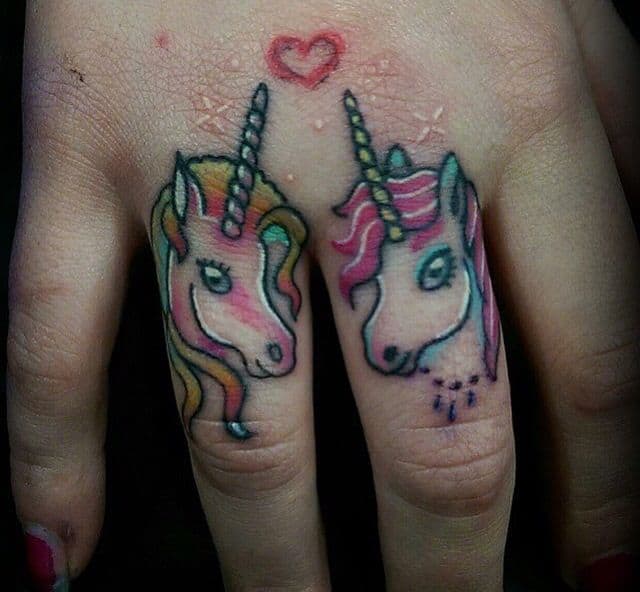 unicorn finger tattoo