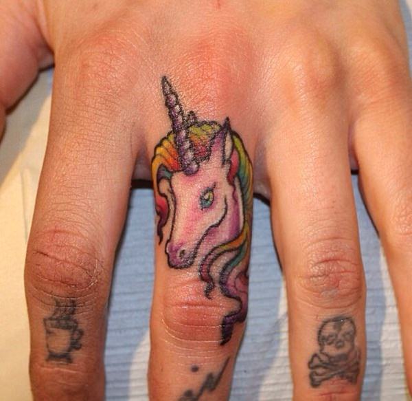 unicorn finger tattoo