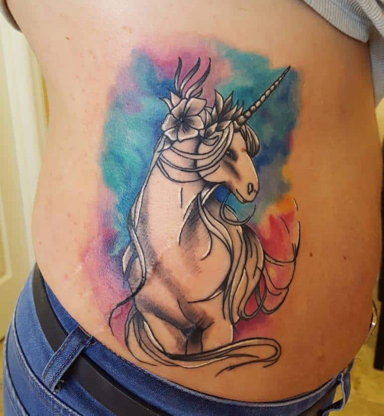 unicorn rib tattoo