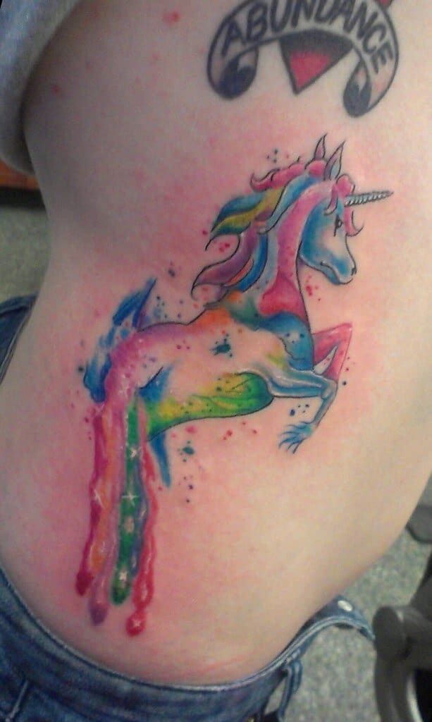 unicorn rib tattoo