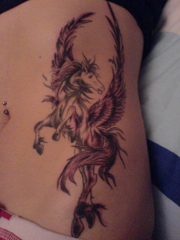 unicorn rib tattoo