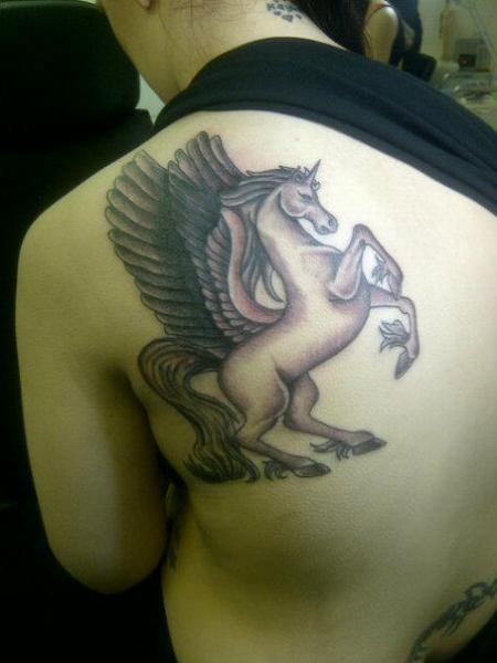 unicorn shoulder tattoo