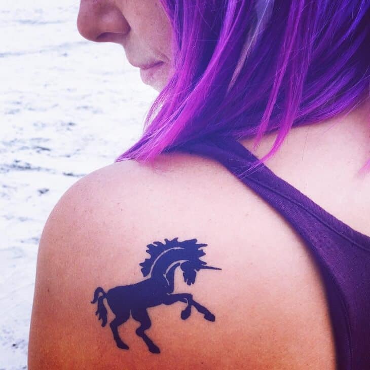 unicorn shoulder tattoo