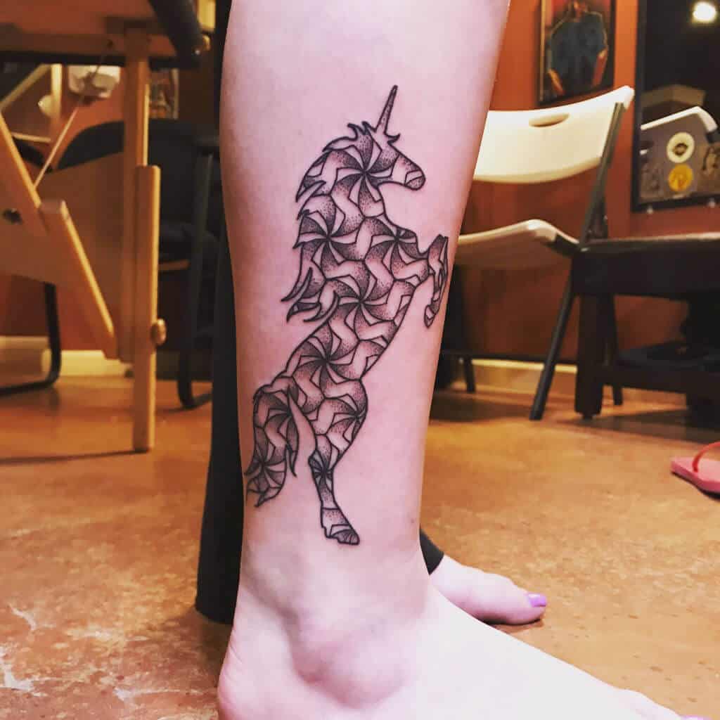 unicorn tattoo on leg