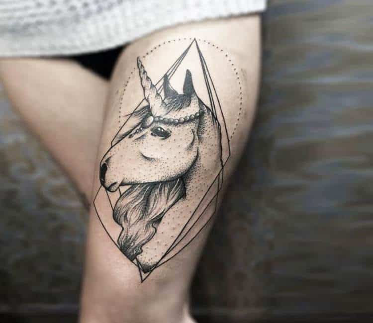 unicorn tattoo on thigh