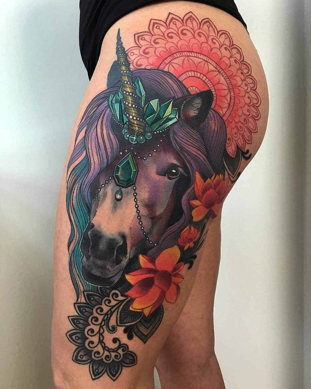 unicorn tattoo on thigh