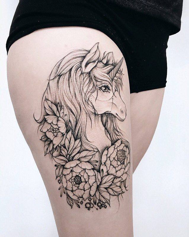 unicorn tattoo on thigh