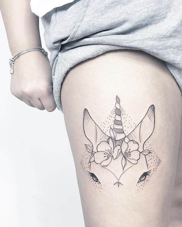 unicorn tattoo on thigh