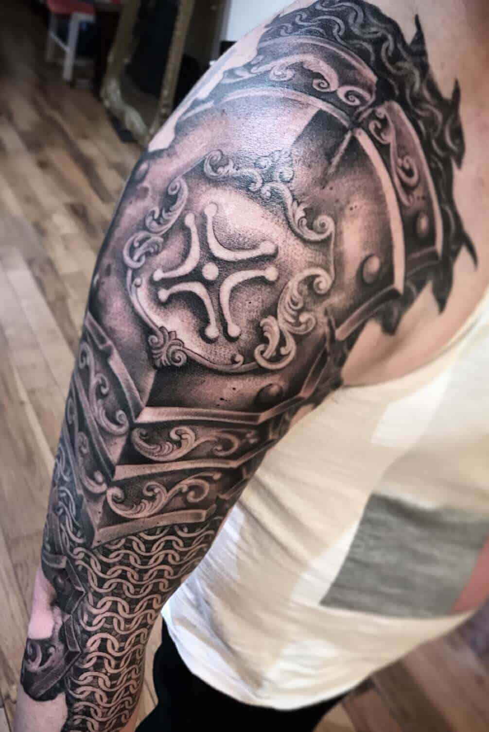 viking armor tattoo on arm