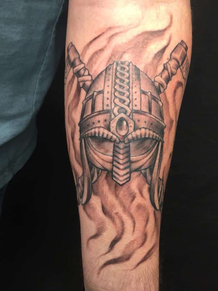 viking helmet tattoo on arm