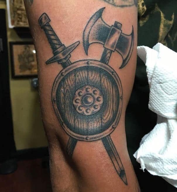 viking shield tattoo on arm