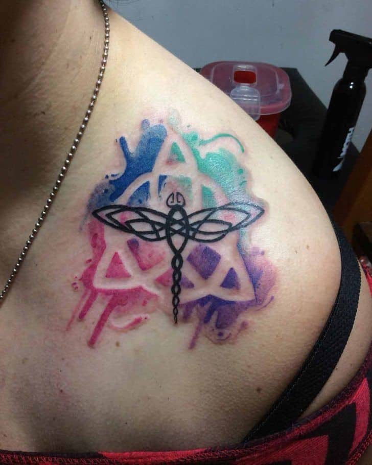 watercolor celtic tattoo on shoulder