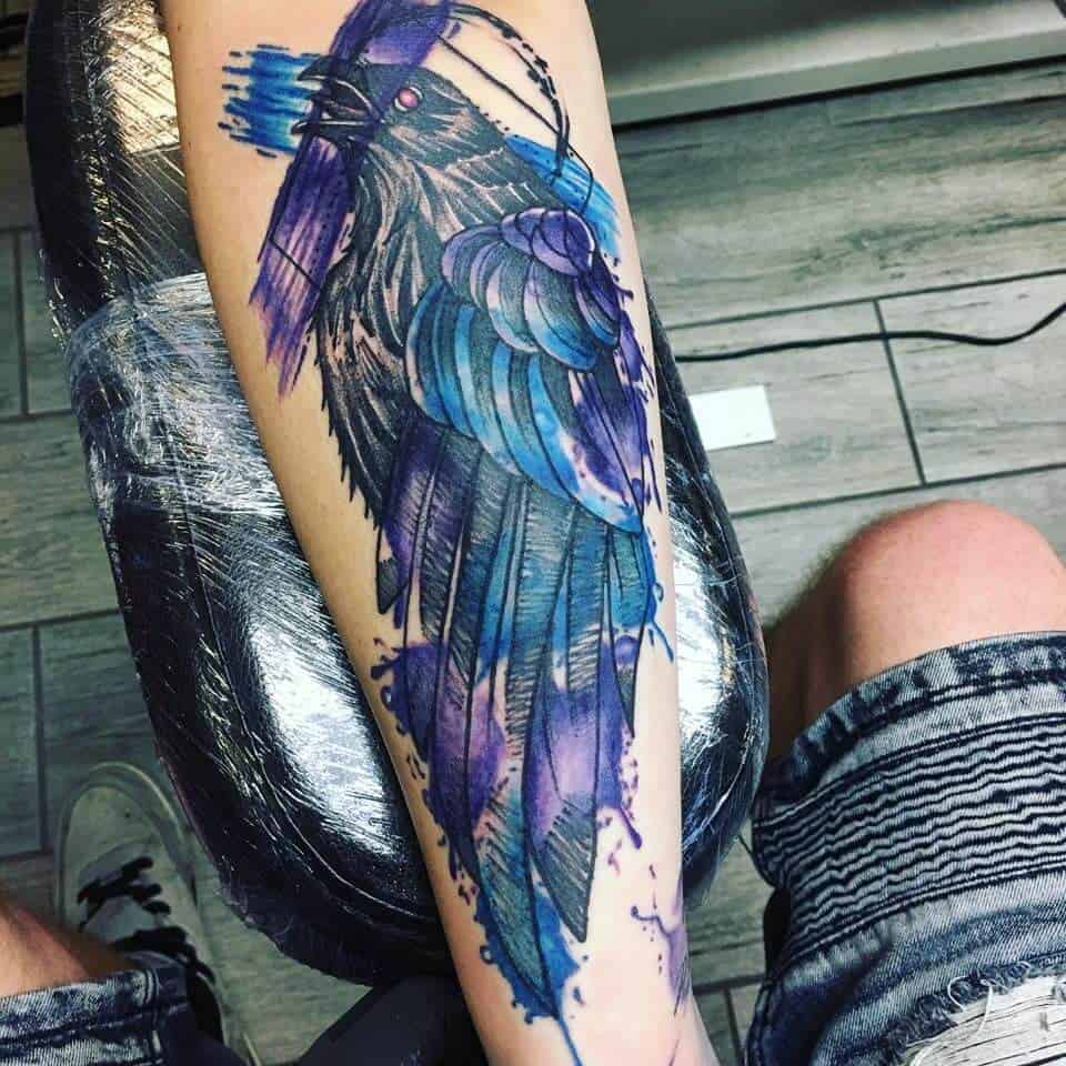 watercolor crow raven tattoo on arm