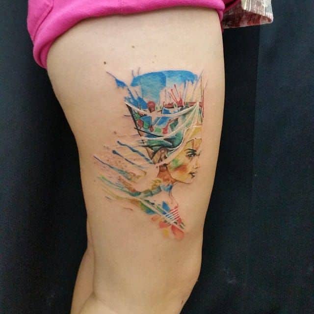 watercolor egyptian tattoo on thigh