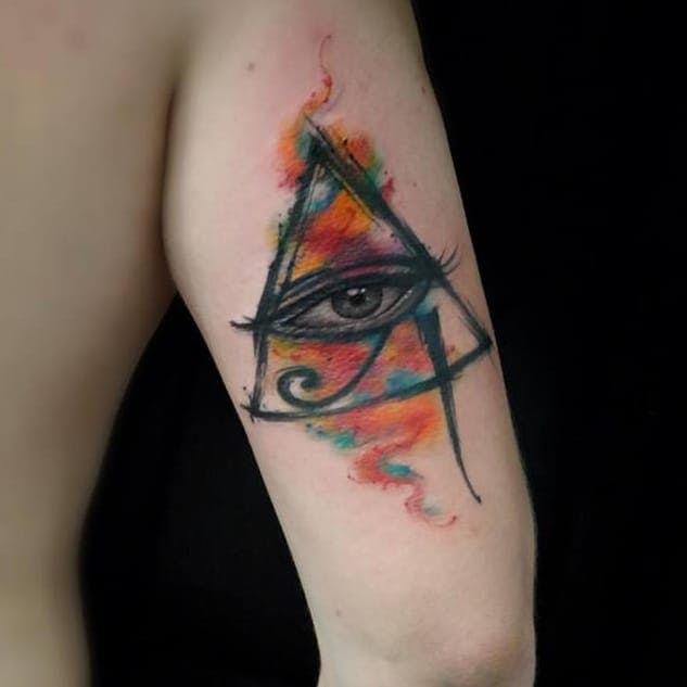 watercolor eye of horus tattoo on arm