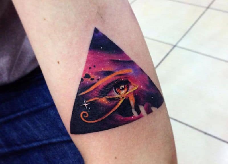 watercolor eye of horus tattoo on arm