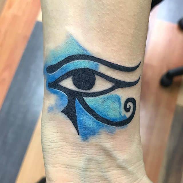 tribal eye of horus tattoo on neck