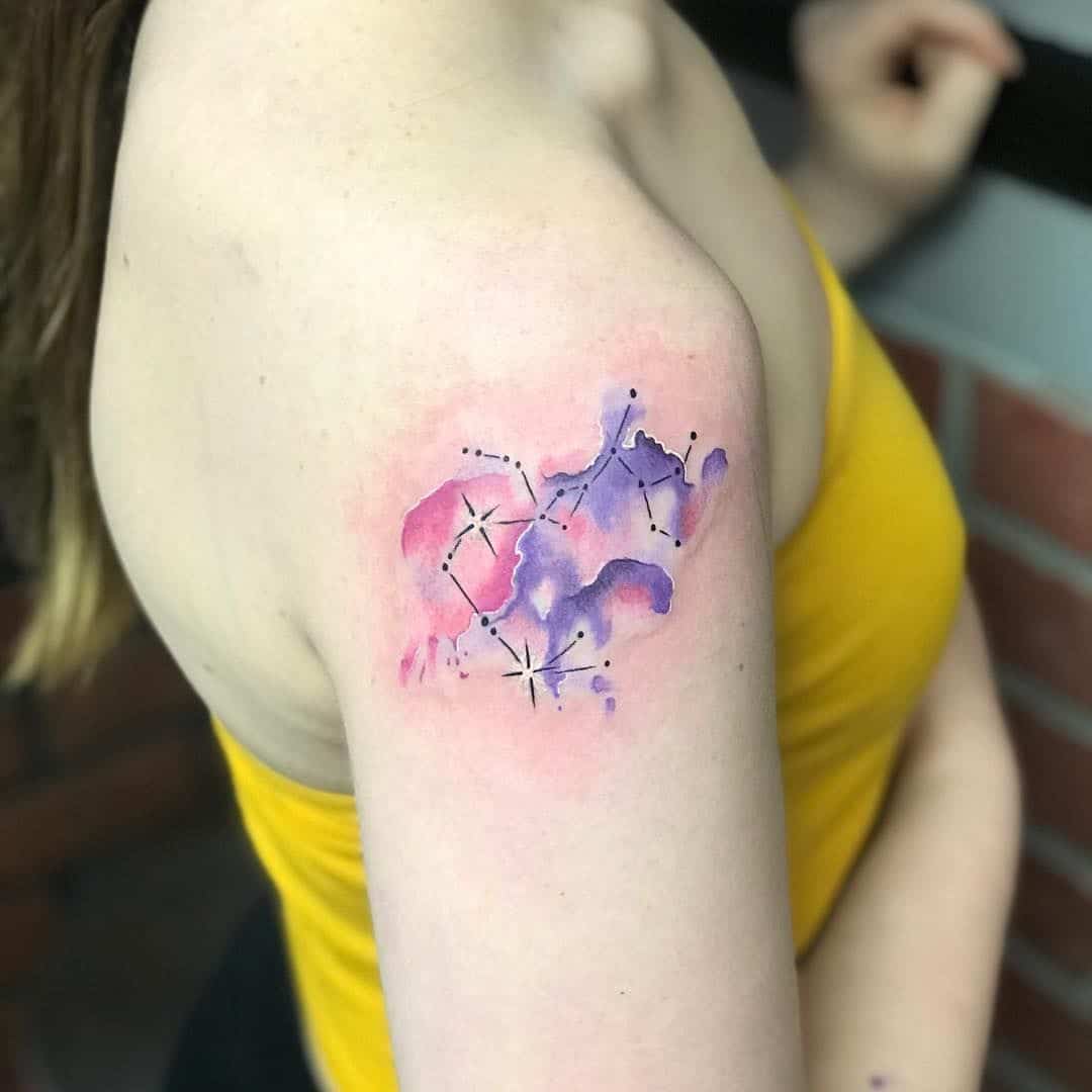 watercolor sagittarius tattoo on arm