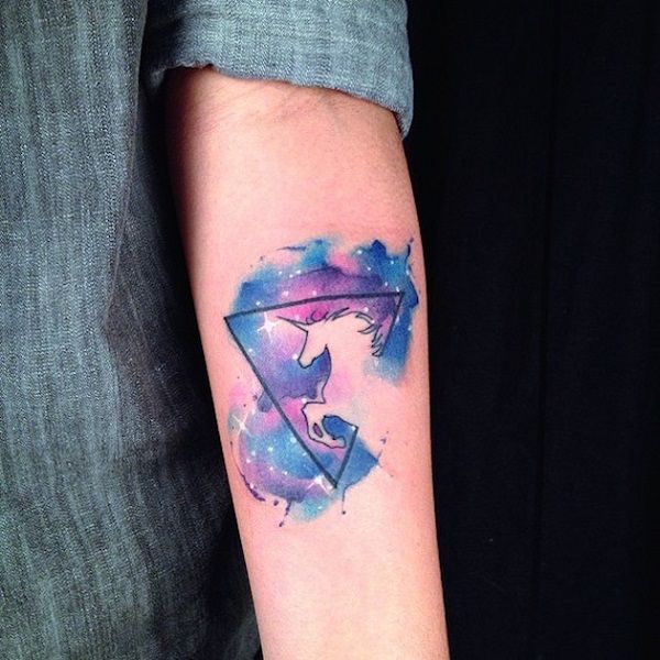 watercolor unicorn tattoo on arm