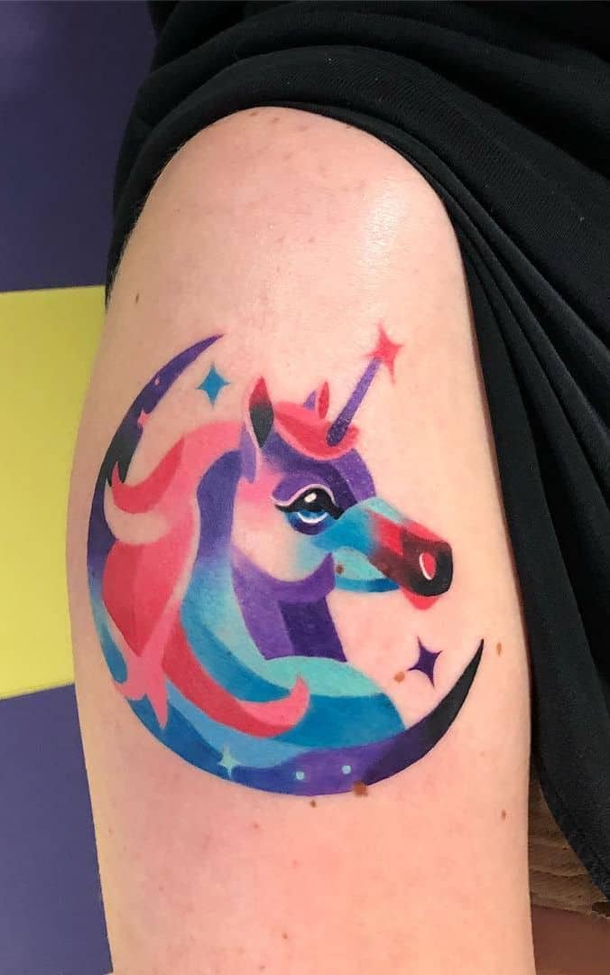 watercolor unicorn tattoo on arm