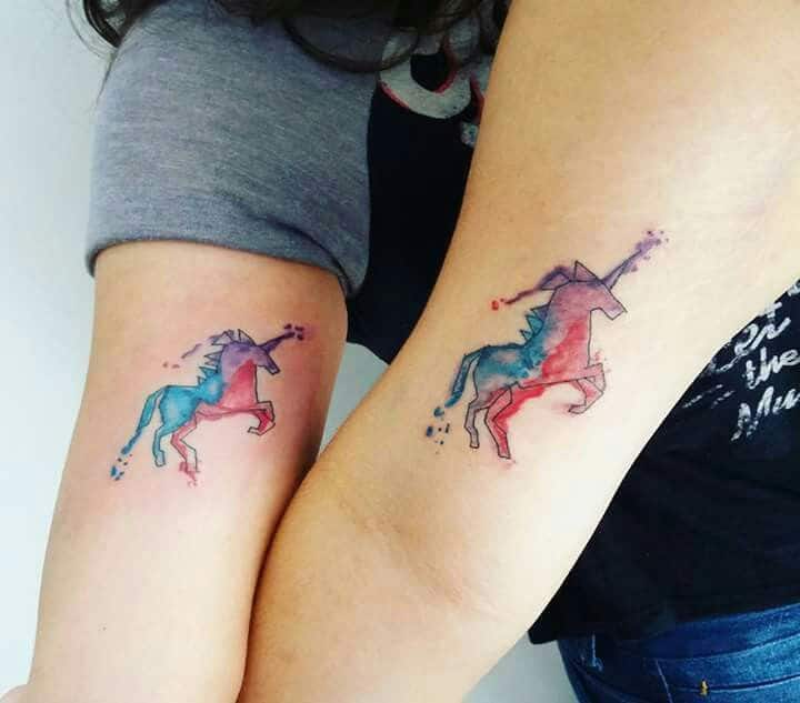 watercolor unicorn tattoo on arm