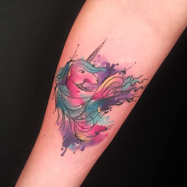 watercolor unicorn tattoo on arm