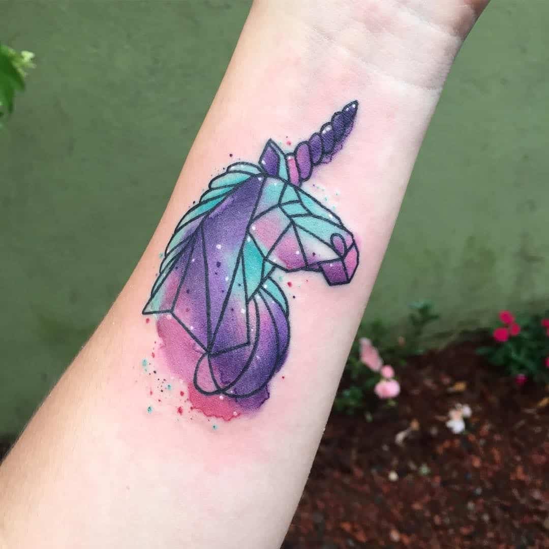 watercolor unicorn tattoo on arm