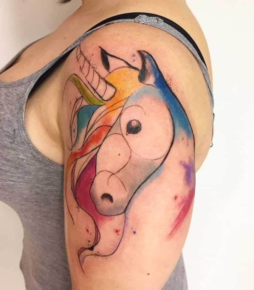 watercolor unicorn tattoo on thigh