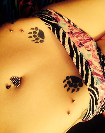 claw tattoos and hip piercing
