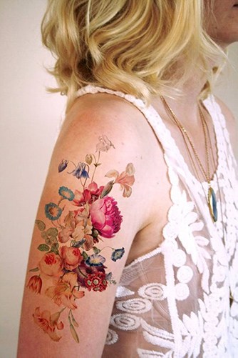 colorful flower tattoo on upper arm