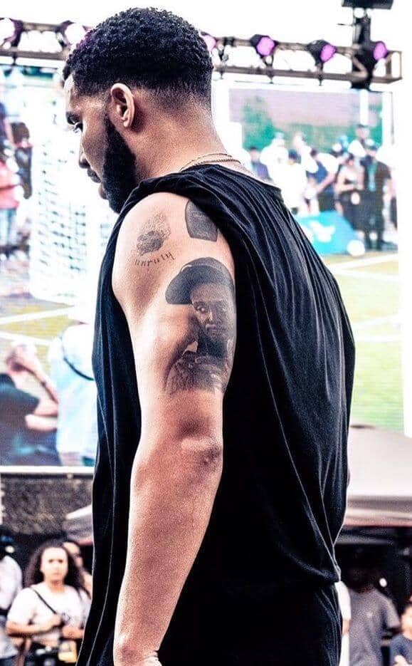 Drake makes fun of his dads tattoo of his face