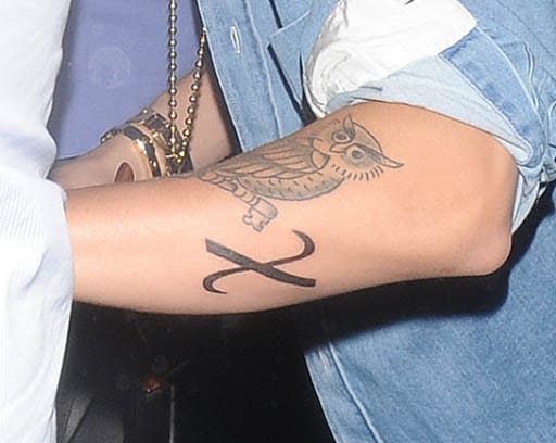 justin bieber christ symbol tattoo