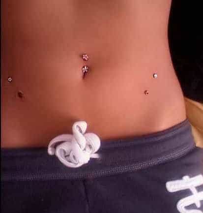 surface hip and navel piercing