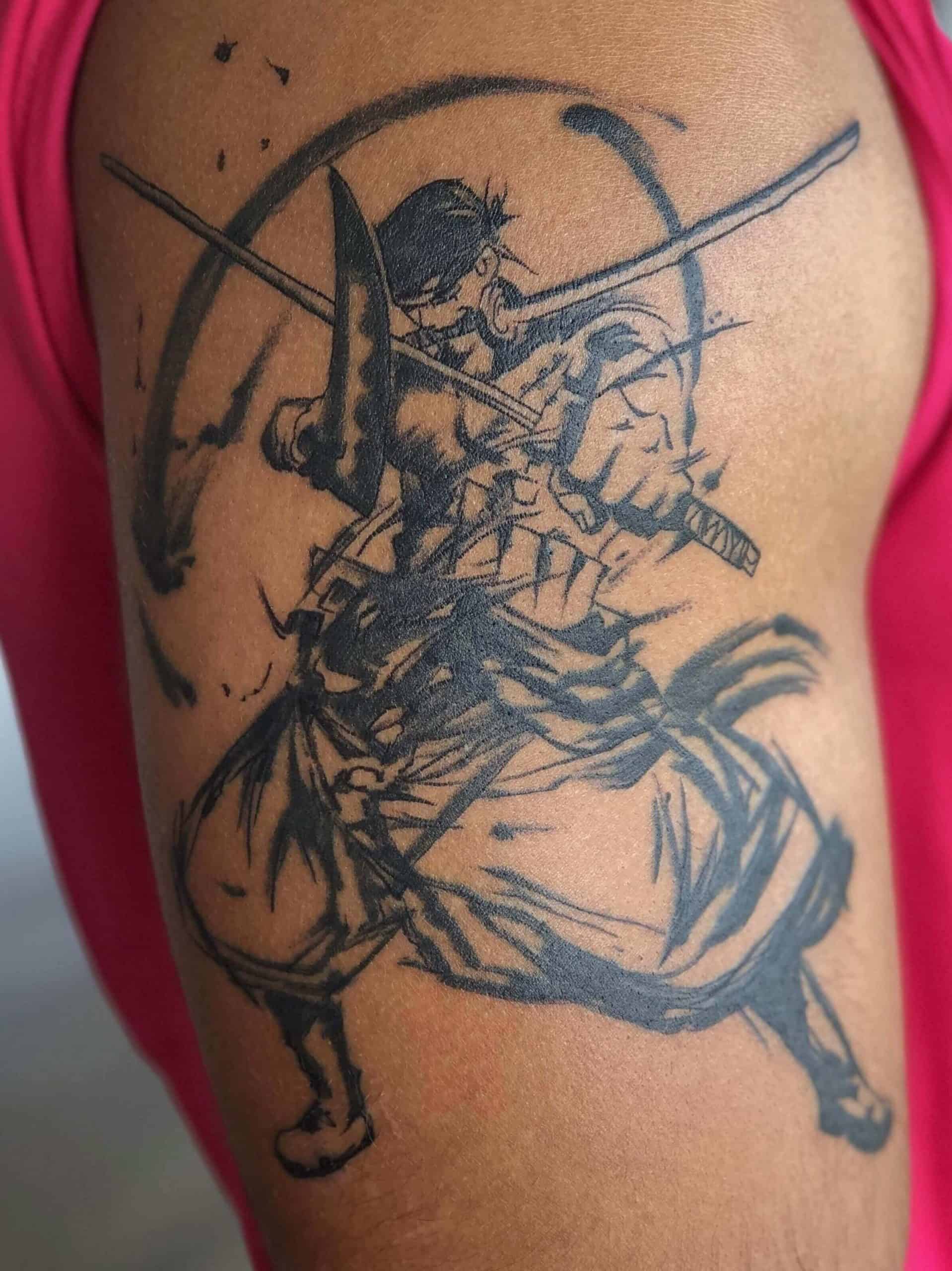 zoro tattoo on arm.