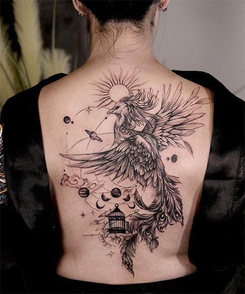 black ink phoenix tattoo on back