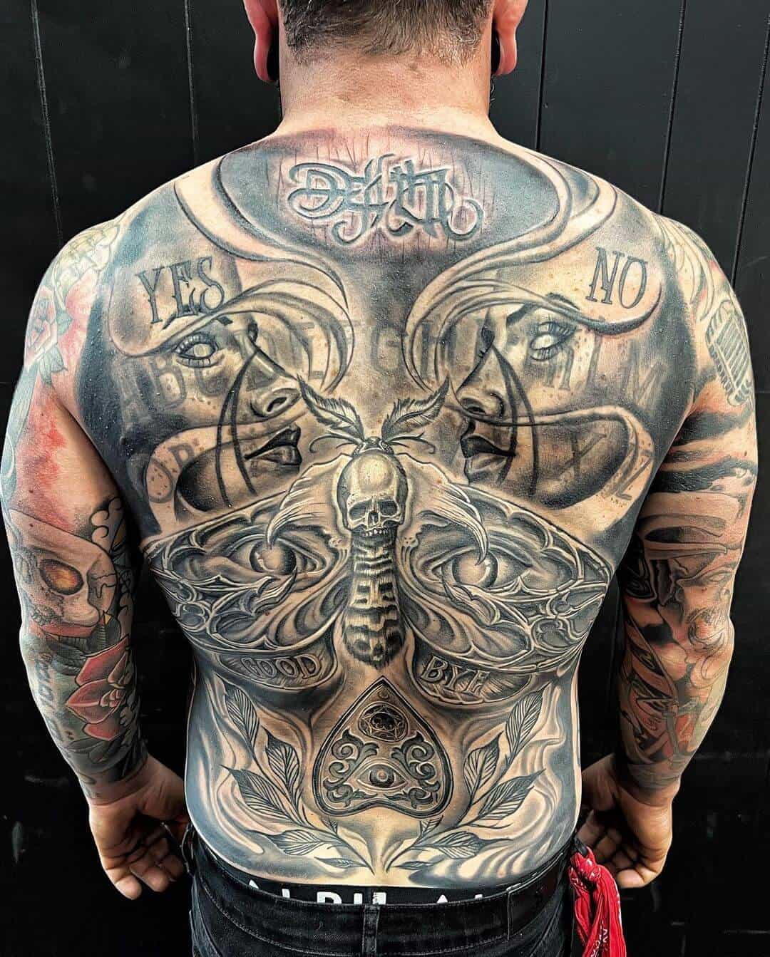 death moth tattoo on back