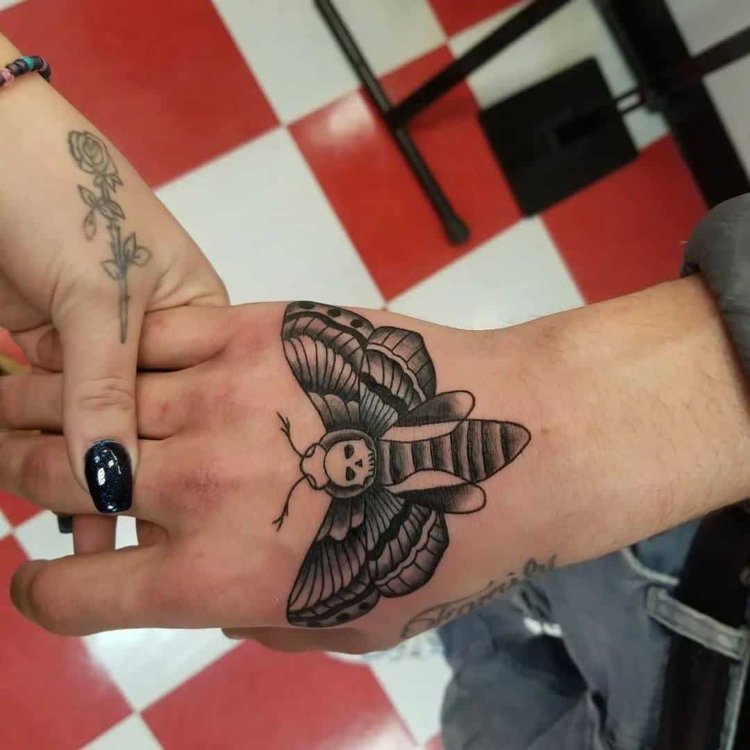 death moth tattoo on hand