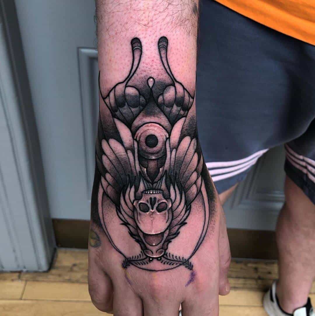 death moth tattoo on hand