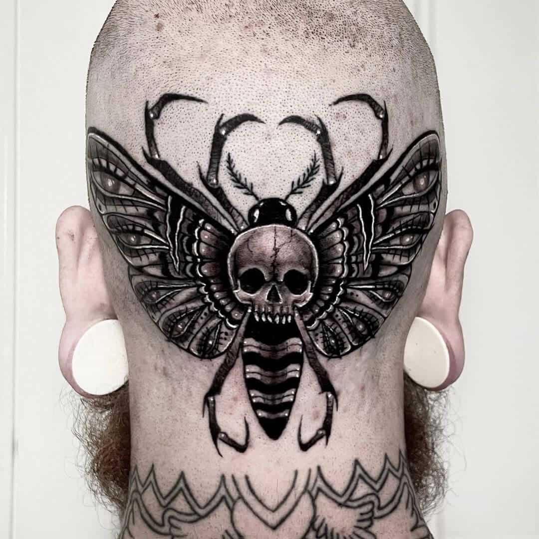 death moth tattoo on head