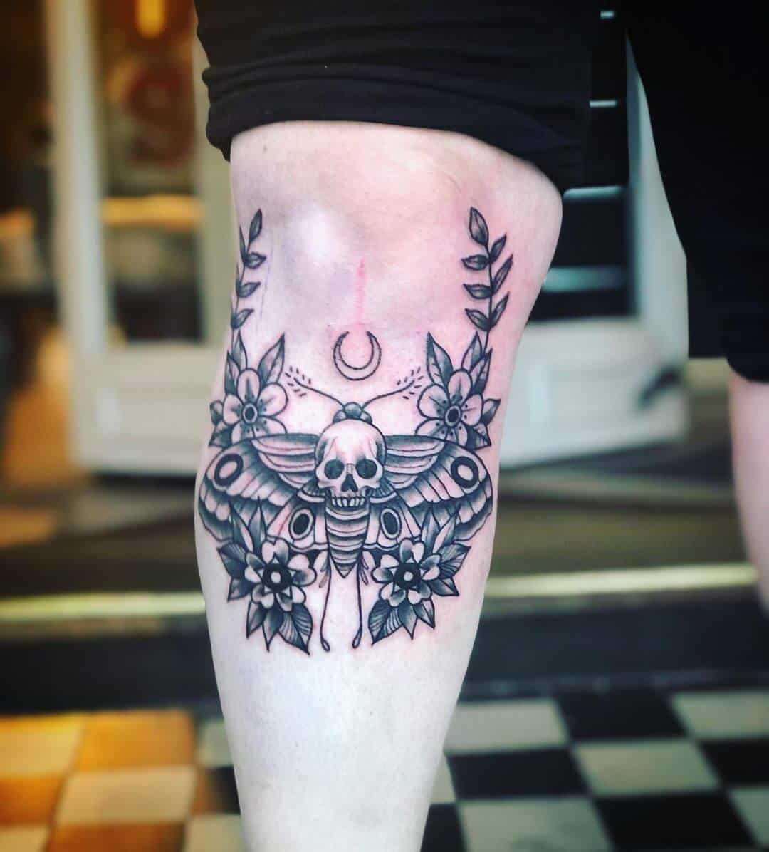 death moth tattoo on leg