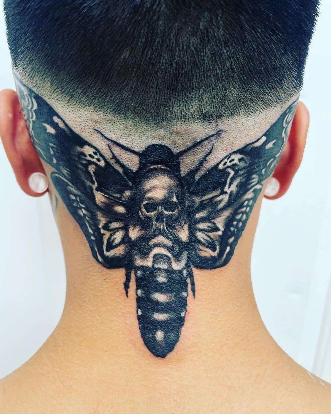 death moth tattoo on neck