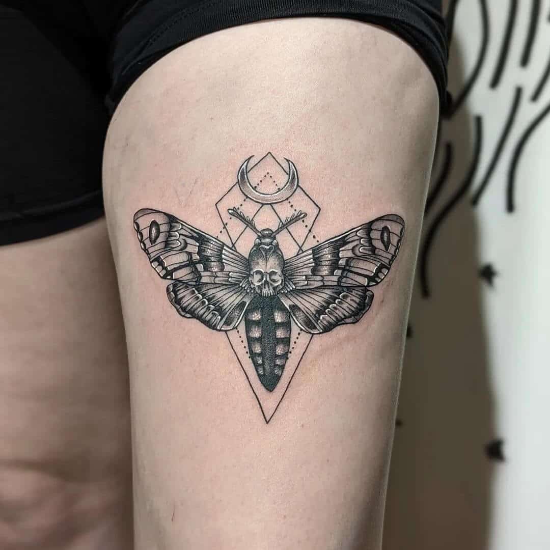 death moth tattoo on thigh