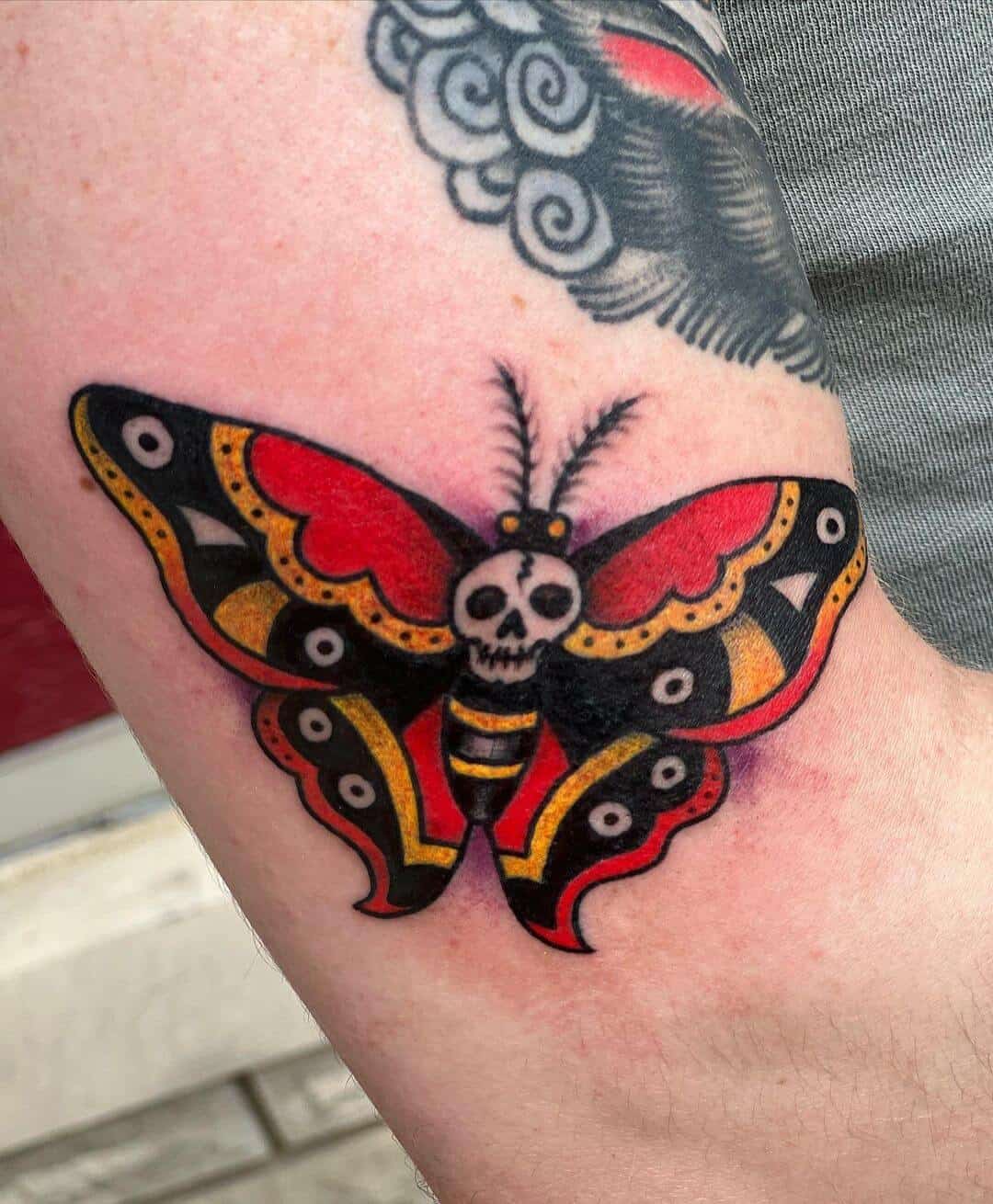 death moth tattoo traditional