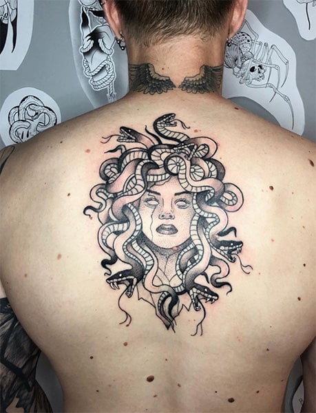 Black back tattoo of medusa