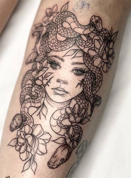 Medusa black ink tattoo on arm