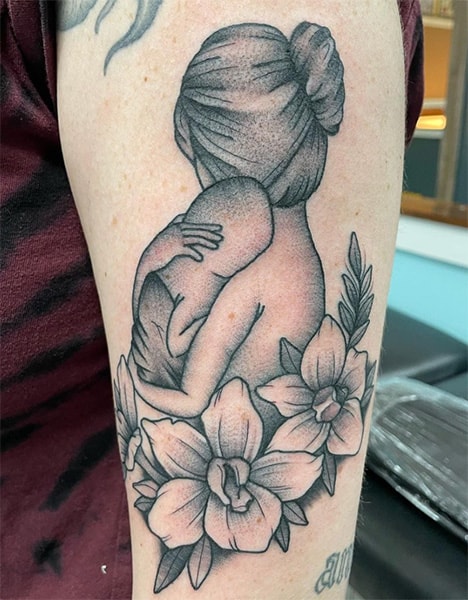 Mom and baby on arm tattoo