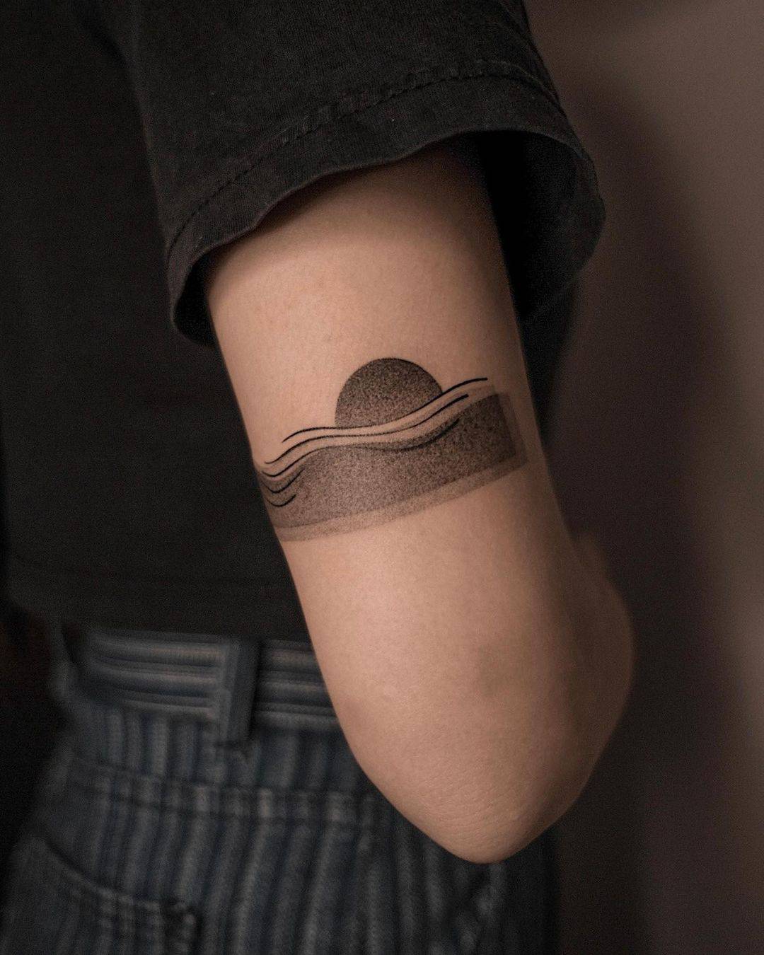 dotted beach tattoo
