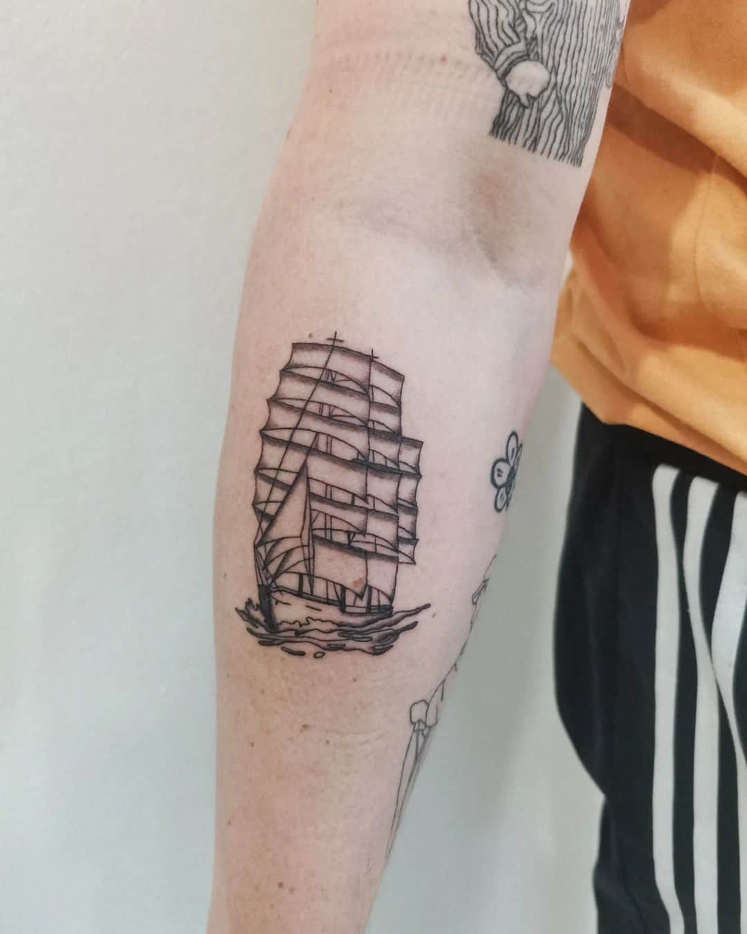 small ship tattoo